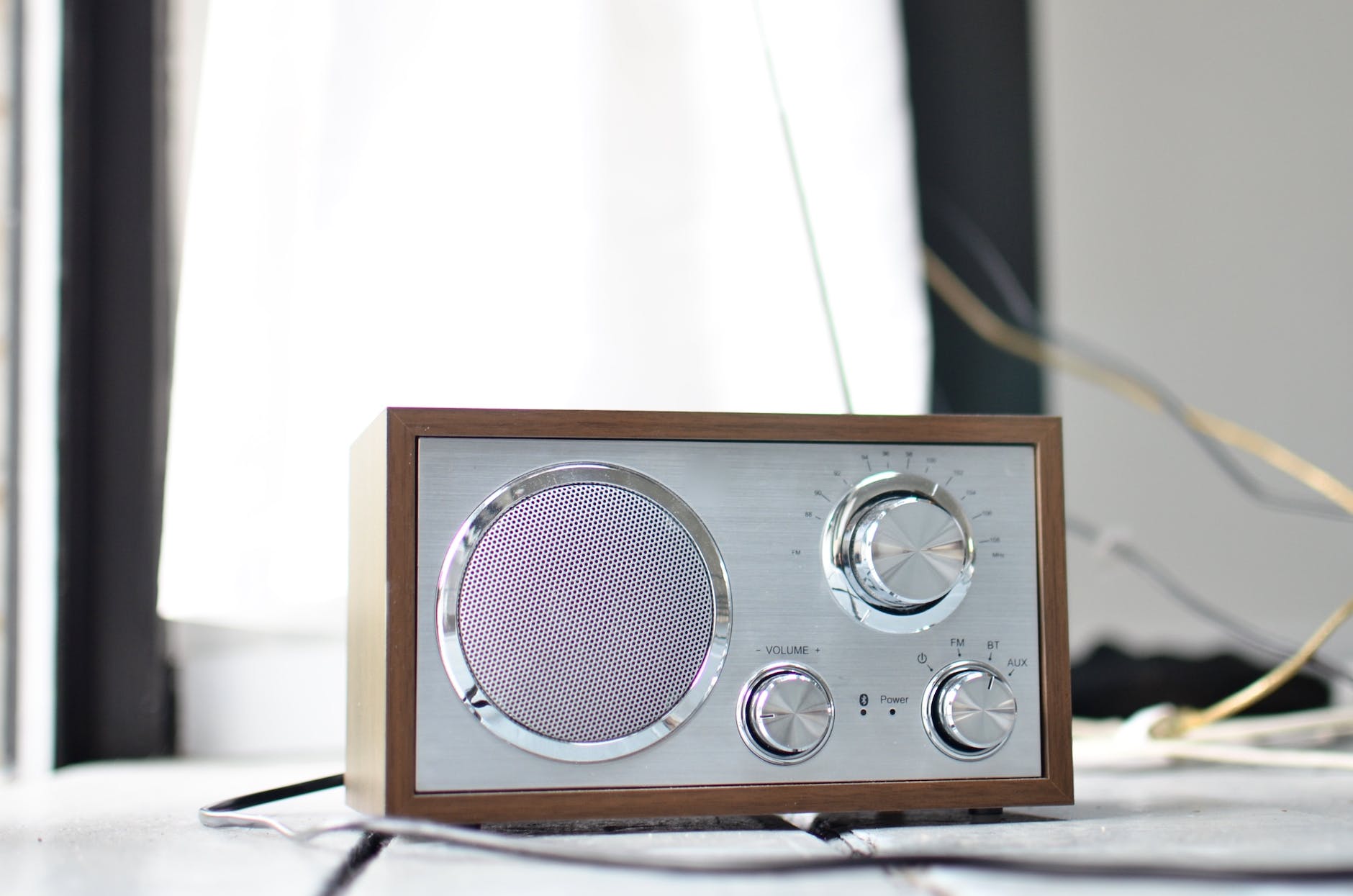 retro styled fm radio placed on desk